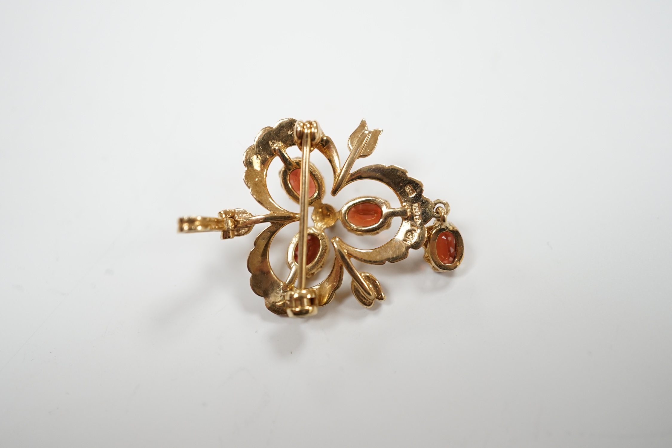 A modern 9ct gold garnet and seed pearl cluster set drop pendant brooch, 39mm, gross weight 4.8 grams.